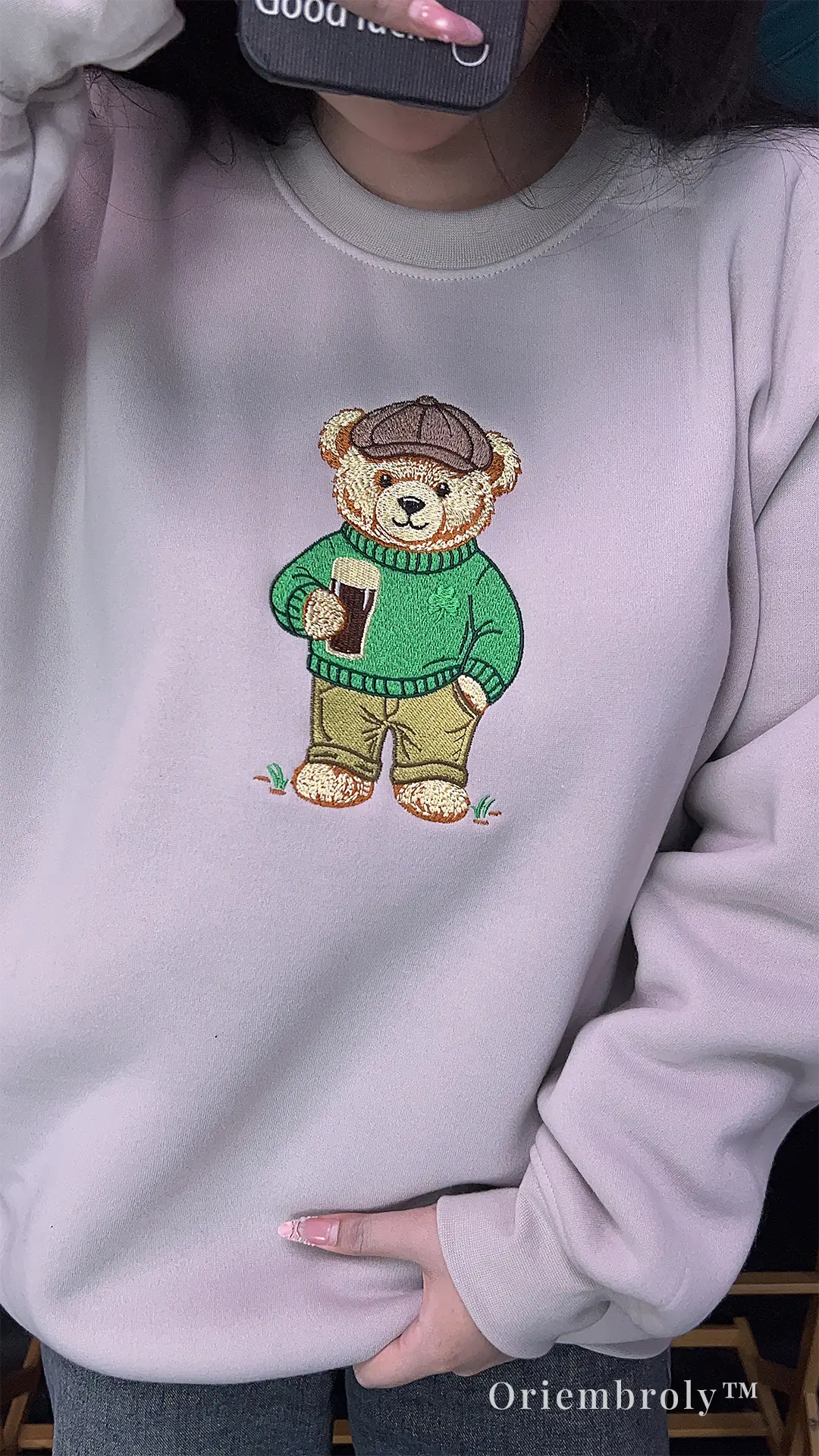 model wearing St Patrick’s Day embroidered bear sweatshirt