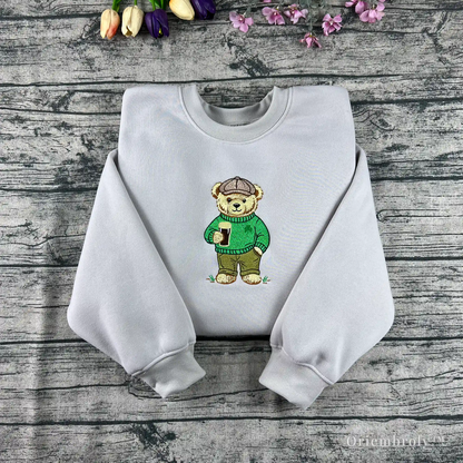 St Patrick’s Day embroidered bear sweatshirt holding a pint of stout