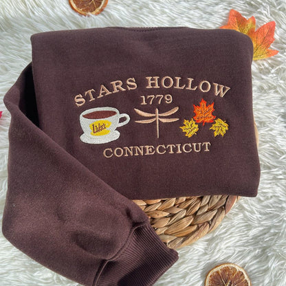 Stars Hollow 1779 Connecticut embroidered sweatshirt, vintage fall hoodie inspired by classic TV show. Cozy autumn crewneck for retro lovers.