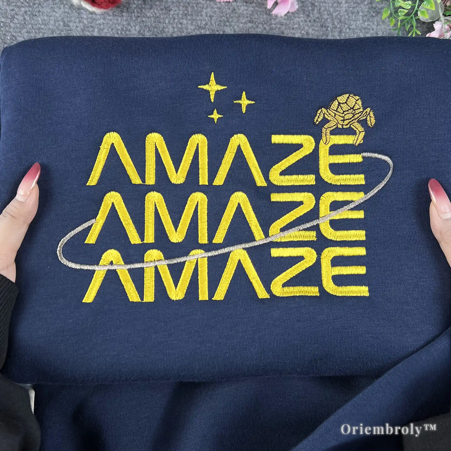 STEM-core aesthetic navy crewneck with minimalist sci-fi embroidery. Futuristic yellow "Amaze Amaze Amaze" design for science teachers, physics students, and space exploration fans