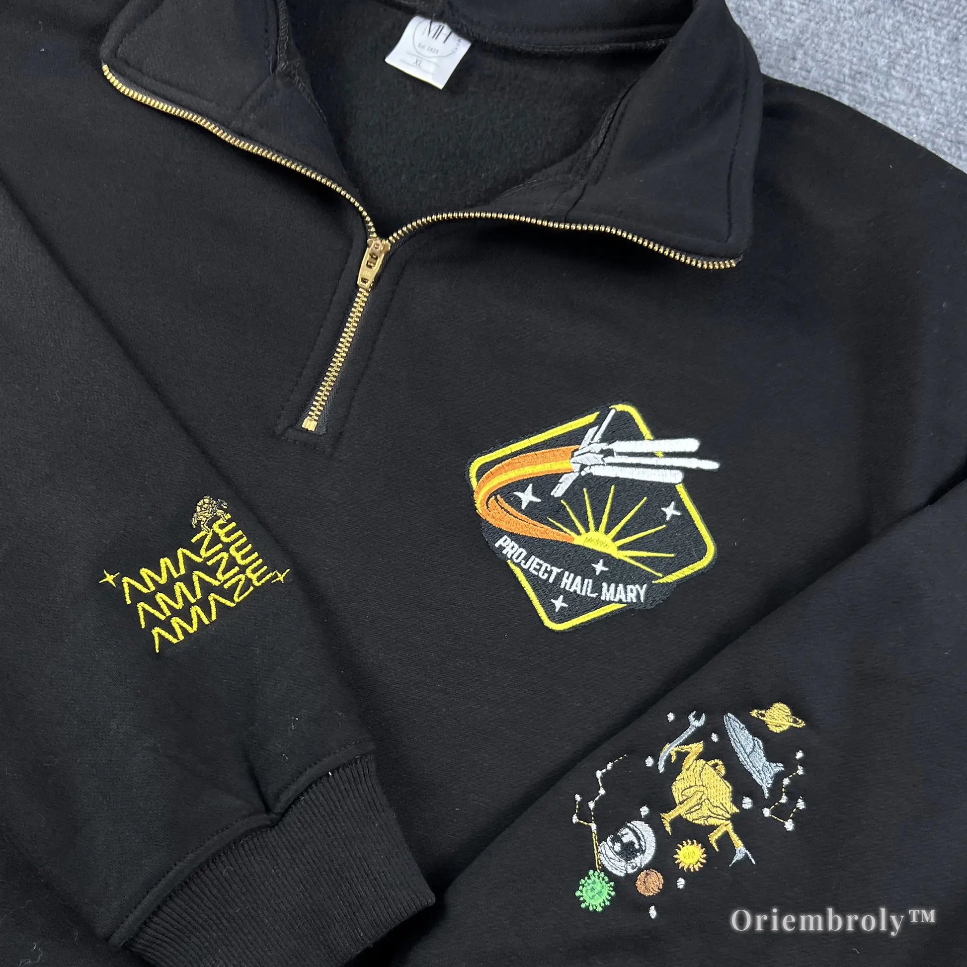  STEM-core fashion staple: embroidered space-themed quarter-zip sweatshirt with technical mission details and alien character motifs. Ideal for campus wear or casual science-themed outfits.