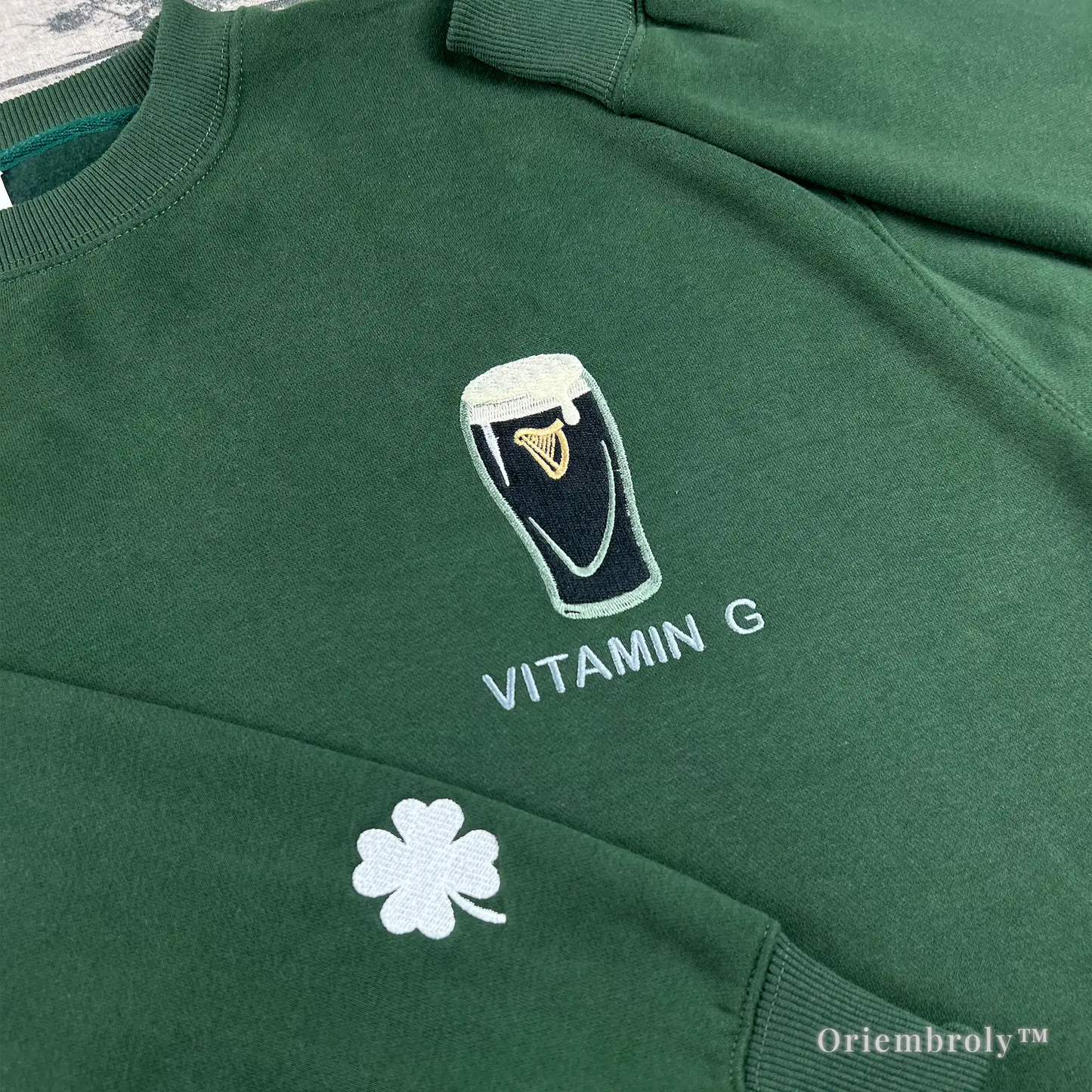 close up embroidered Irish stout pint design on crewneck sweatshirt