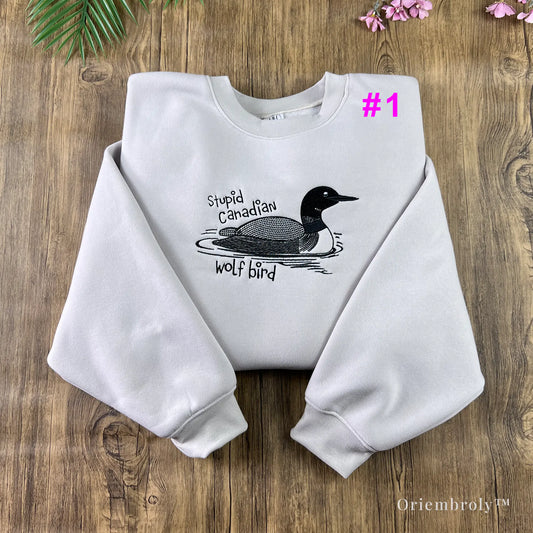 Minimalist crewneck sweatshirt with embroidered loon design