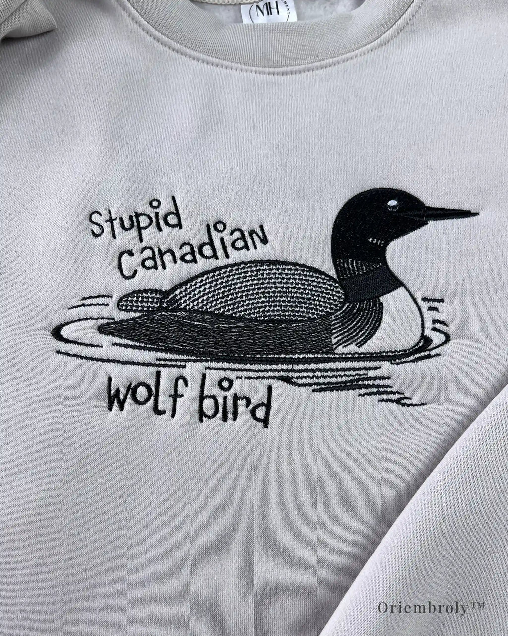 Embroidered sweatshirt featuring surreal loon humor design