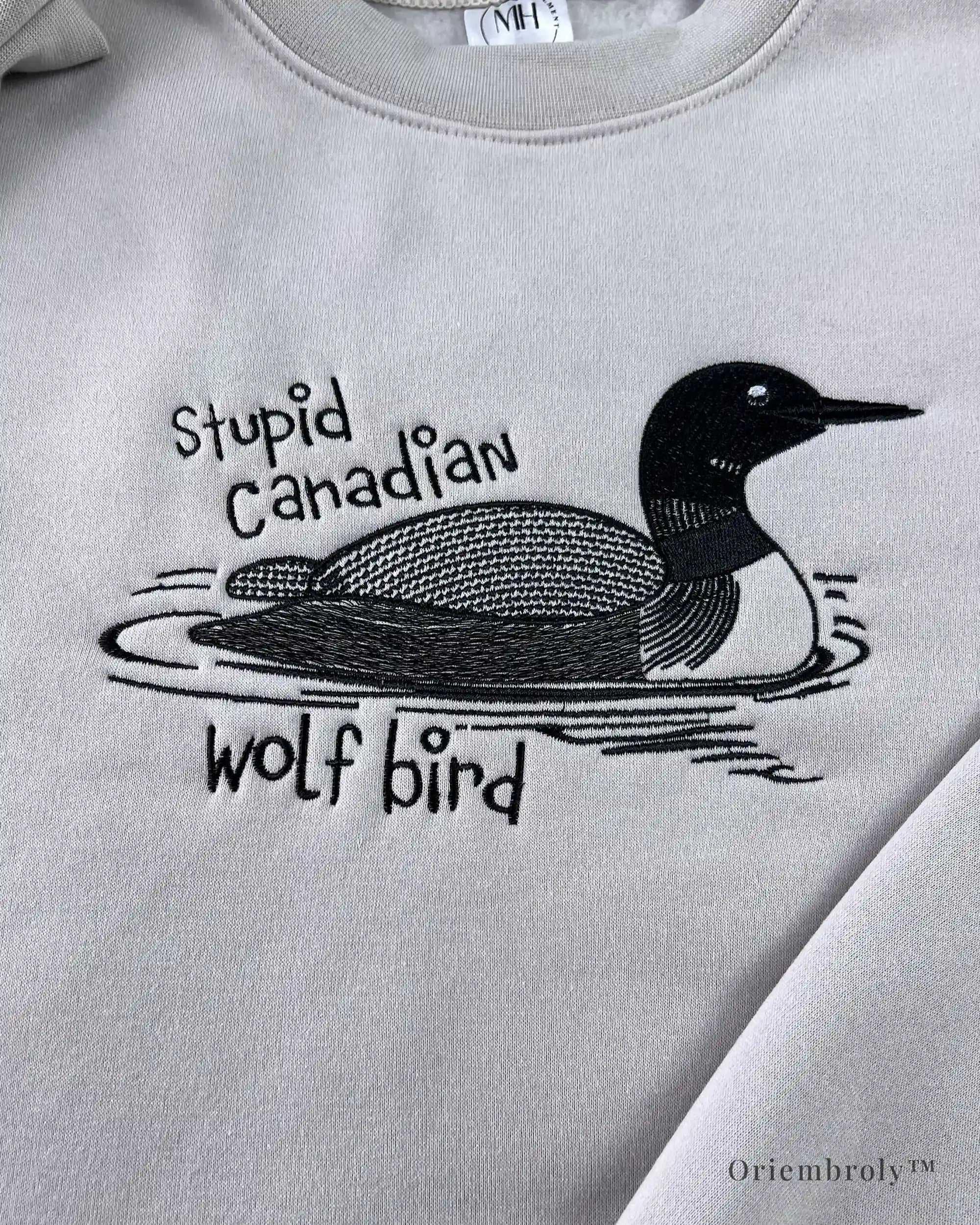 Embroidered sweatshirt featuring surreal loon humor design