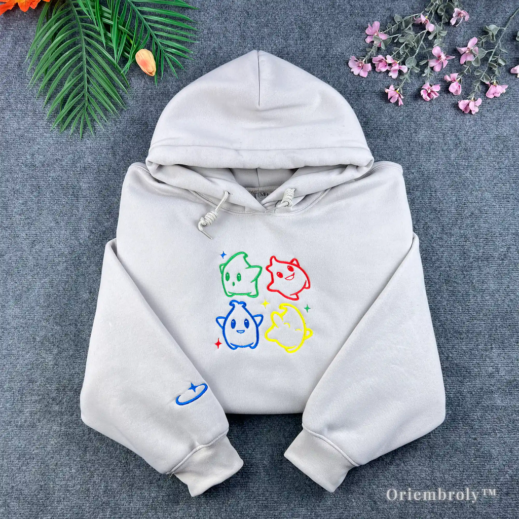 White Super Mario Galaxy hoodie featuring colorful embroidered Luma characters.