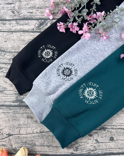 Supernatural embroidered sweatshirt featuring Dean, Sam, and Castiel design.