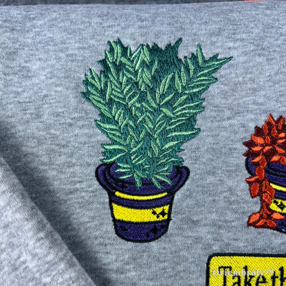 Survival horror gaming gift: Heather grey sweatshirt with embroidered biohazard herbs