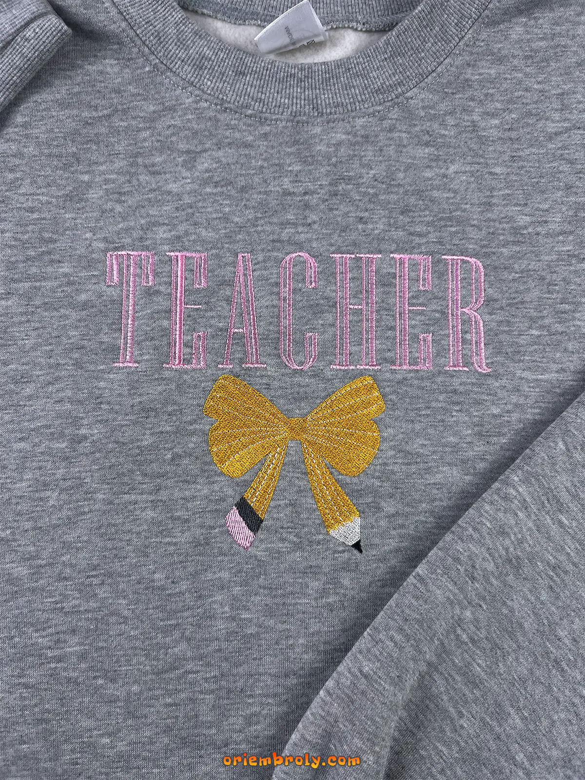 Cute cozy teacher sweater with embroidered graphics