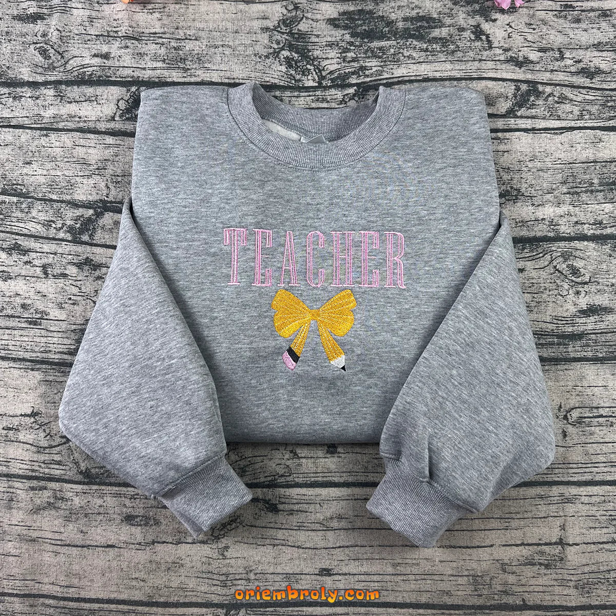 Teacher embroidered sweatshirt with bow and pencil design