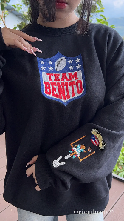 football fan wearing embroidered Team Benito sweatshirt