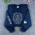 Navy Terrasen Throne of Glass embroidered sweatshirt featuring the stag and "To whatever end" quote