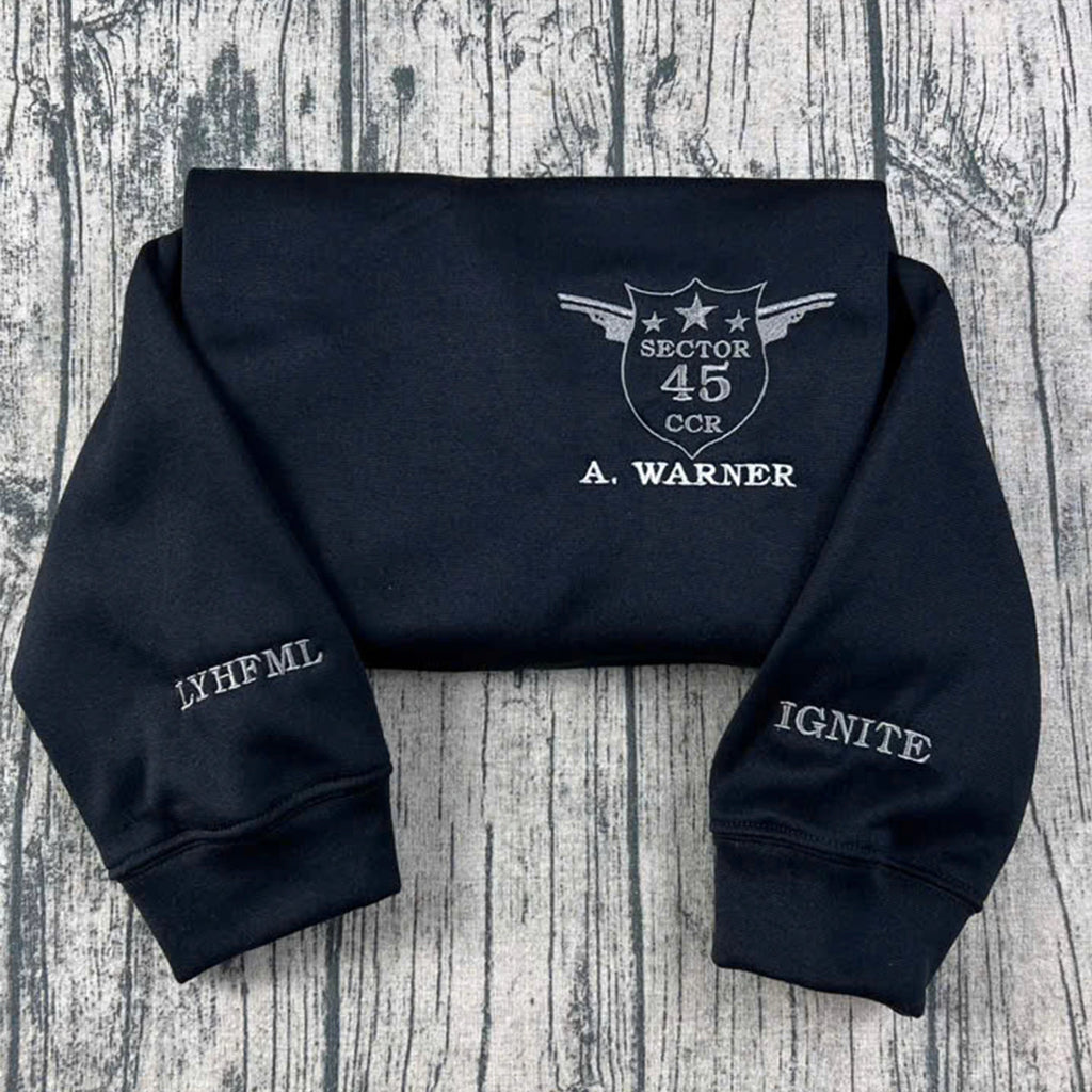The Shatter Me crewneck sweatshirt, custom embroidered Kishimoto Sector 45 uniform design, featuring A Warner. Perfect for book lovers and fans of Hell Is Empty shirt