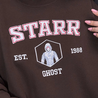 Brown sweatshirt with 'STARR' and 'GHOST' design on a dark background