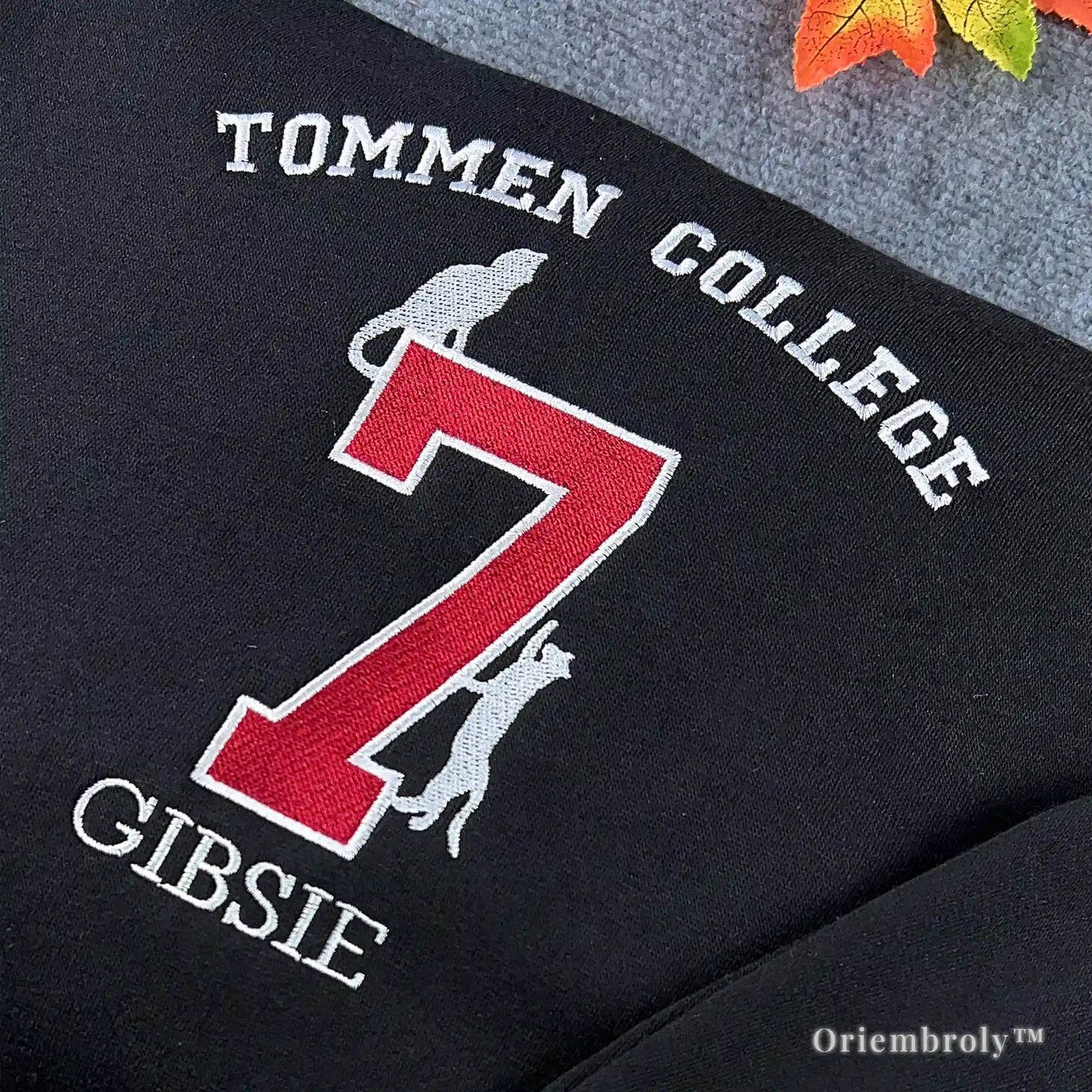 Detailed Tommen College embroidery with Gibsie name and yellow sun on the sleeve