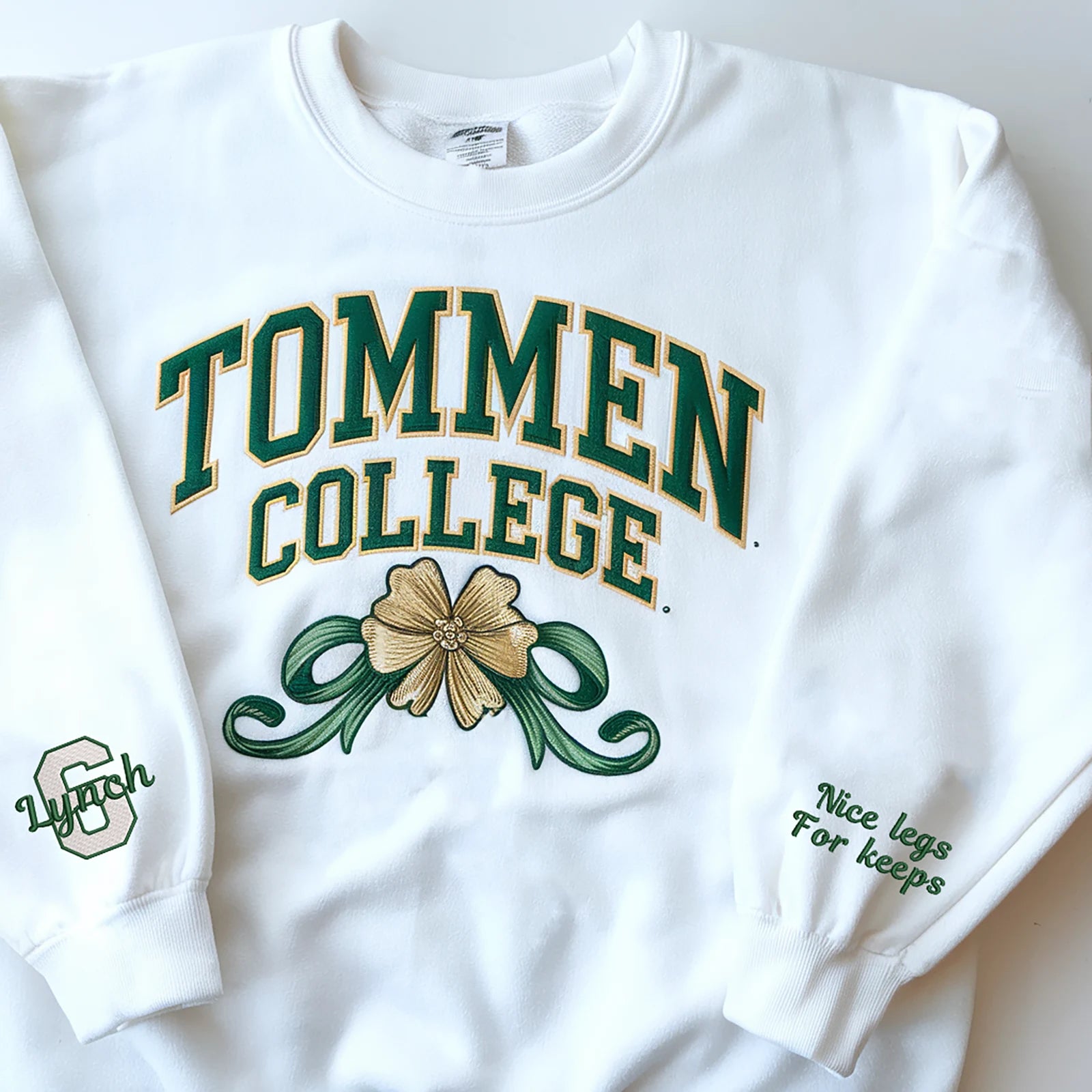 Preppy embroidered Tommen College sweatshirt with a bow and clovers, perfect for varsity aesthetic lovers.