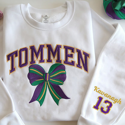 Premium embroidered Tommen College sweatshirt with varsity lettering, bow, and shamrocks – perfect for high-quality fashion lovers.