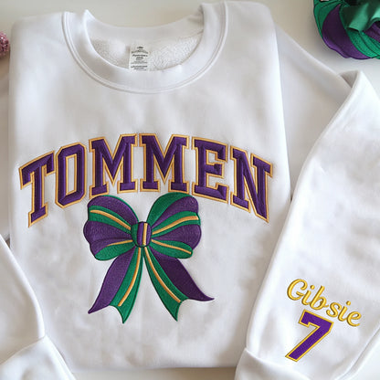 Premium embroidered Tommen College sweatshirt with varsity lettering, bow, and shamrocks – perfect for high-quality fashion lovers.