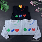 Tommen College varsity embroidered crewneck with shamrock football heart icons