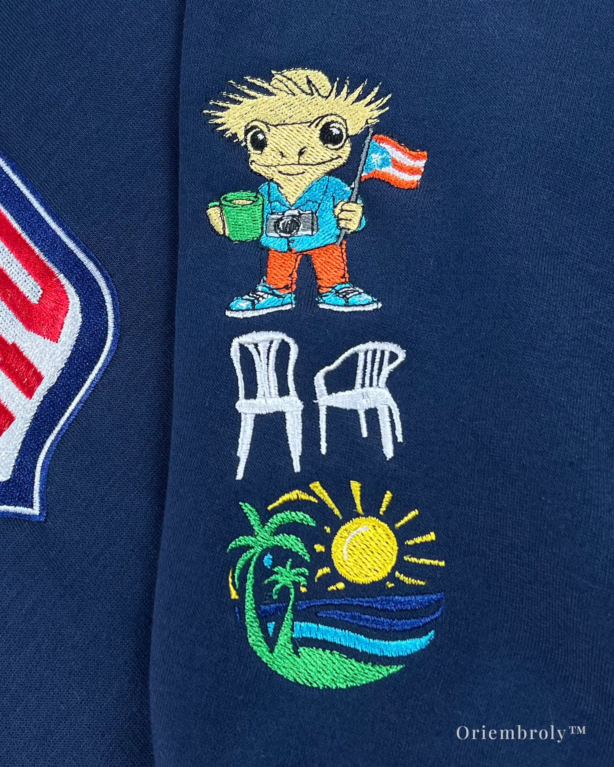 Embroidered character patch on Team Benito sweatshirt sleeve