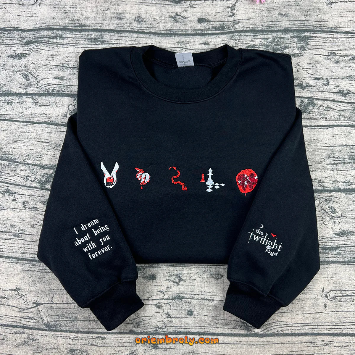 Black crewneck with book inspired embroidered symbols