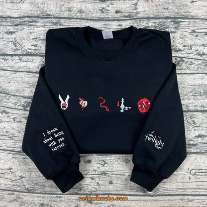 Black crewneck with book inspired embroidered symbols