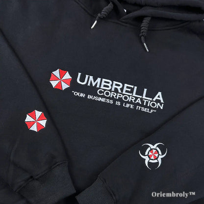 Our Business is Life Itself" Umbrella Corp black hoodie featuring biohazard embroidery