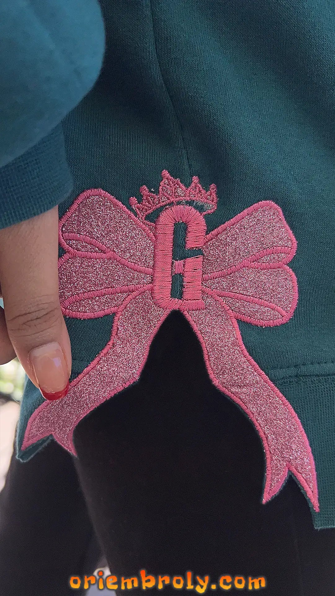 Unisex fan sweatshirt with Defying Gravity Bow embroidery