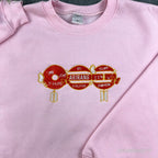 Unisex K-pop style white sweatshirt with vibrant red BTS-inspired embroidery