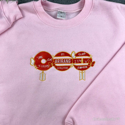 Unisex K-pop style white sweatshirt with vibrant red BTS-inspired embroidery