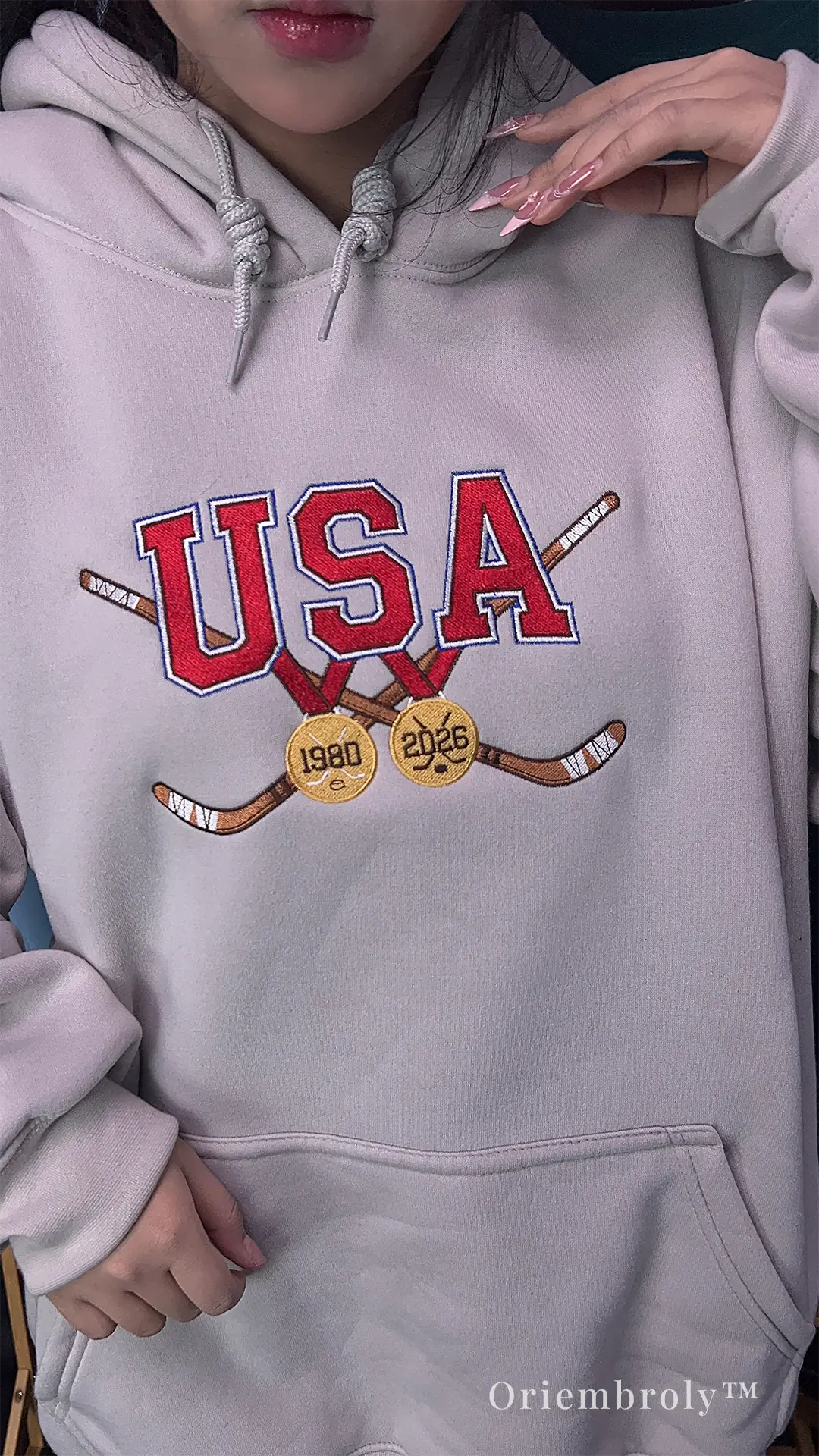 American hockey fan wearing embroidered USA hoodie