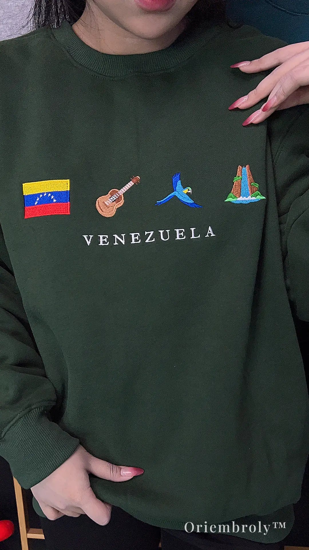 model wearing Venezuela embroidered sweatshirt casually
