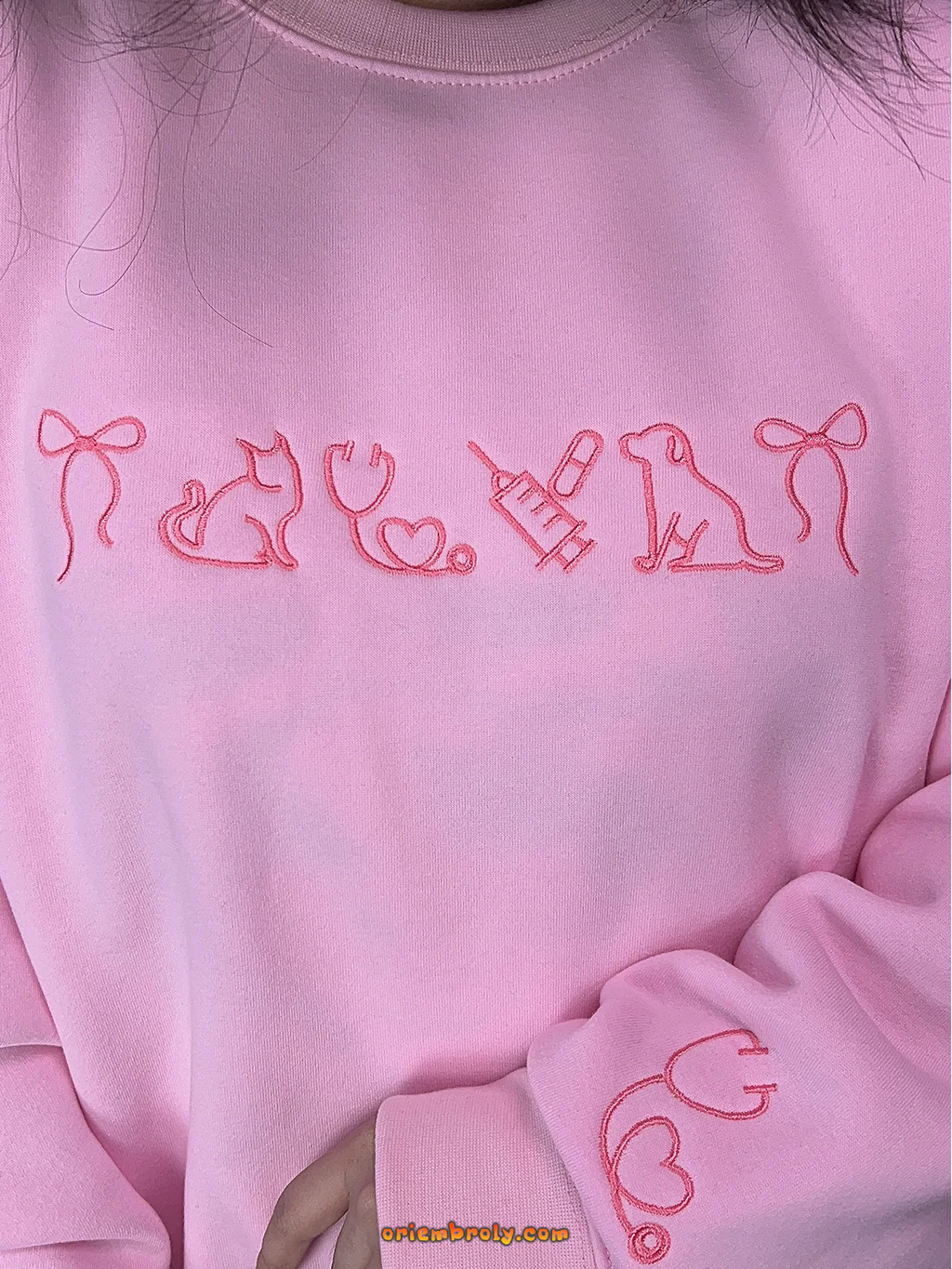 Cute animal lover sweatshirt in pink with stethoscope and pet embroidery — ideal for clinic wear or casual days.