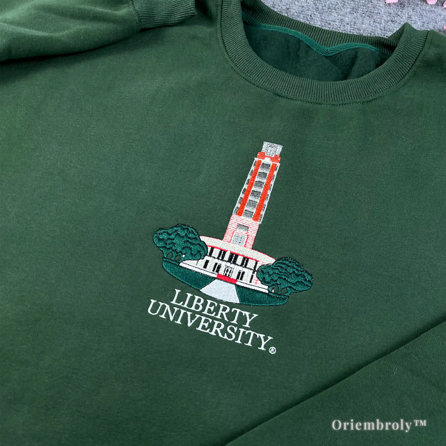 Vintage-style Auburn Tigers embroidered green crewneck sweater for alumni and students.