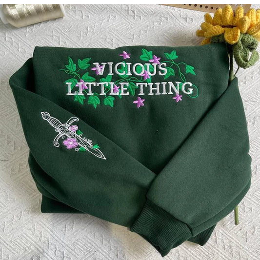 Vintage Fearless Little Thing embroidered sweatshirt, cozy Powerless hoodie, perfect Booktok merch for readers.
