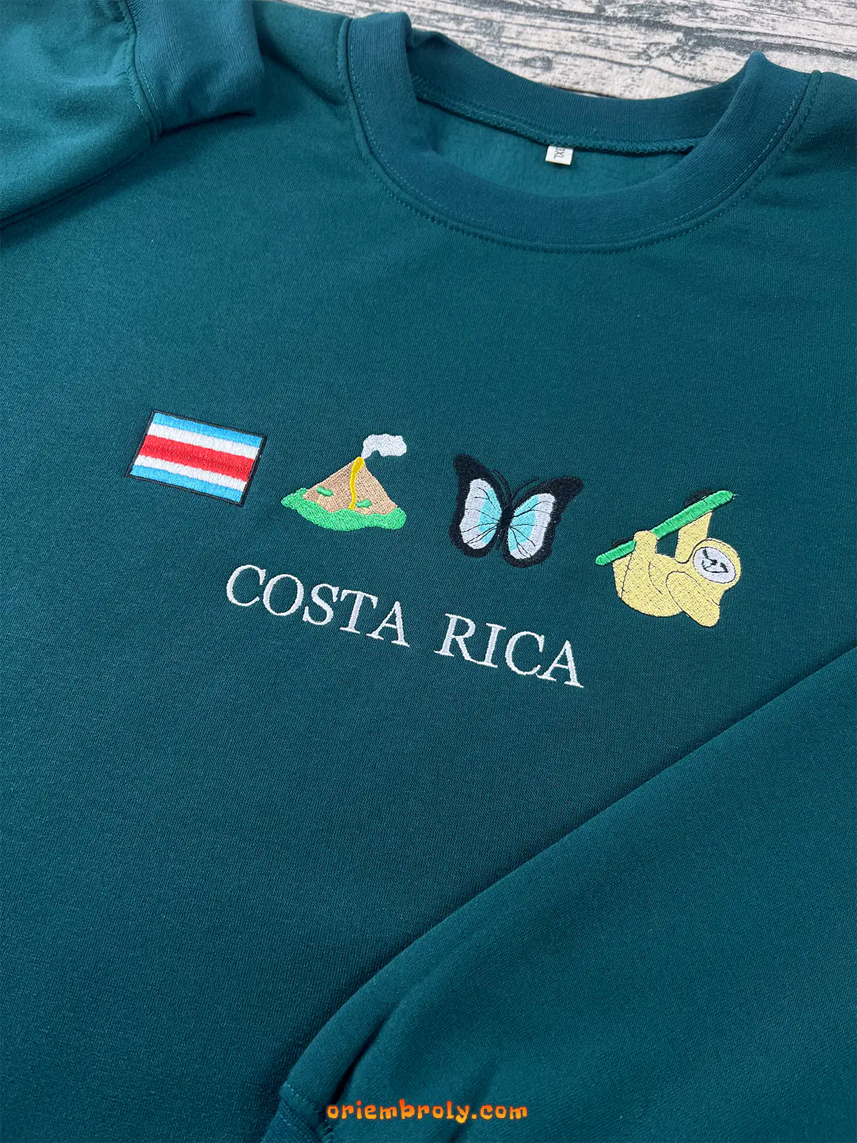 Sloth and volcano embroidered crewneck sweater