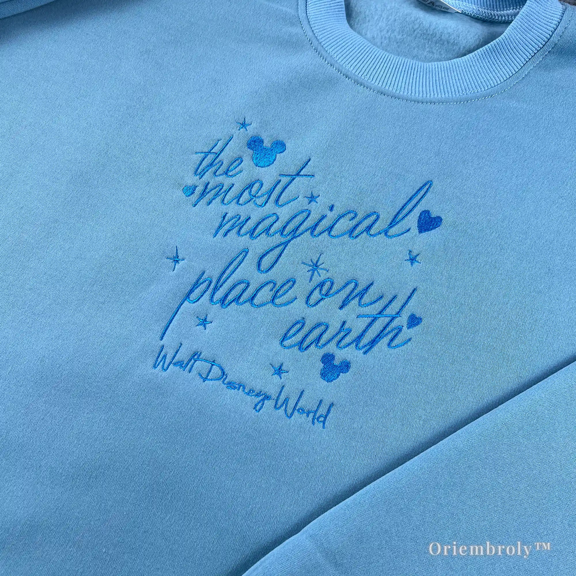 Unisex light blue Walt Disney World crewneck sweater featuring Mickey Mouse embroidery