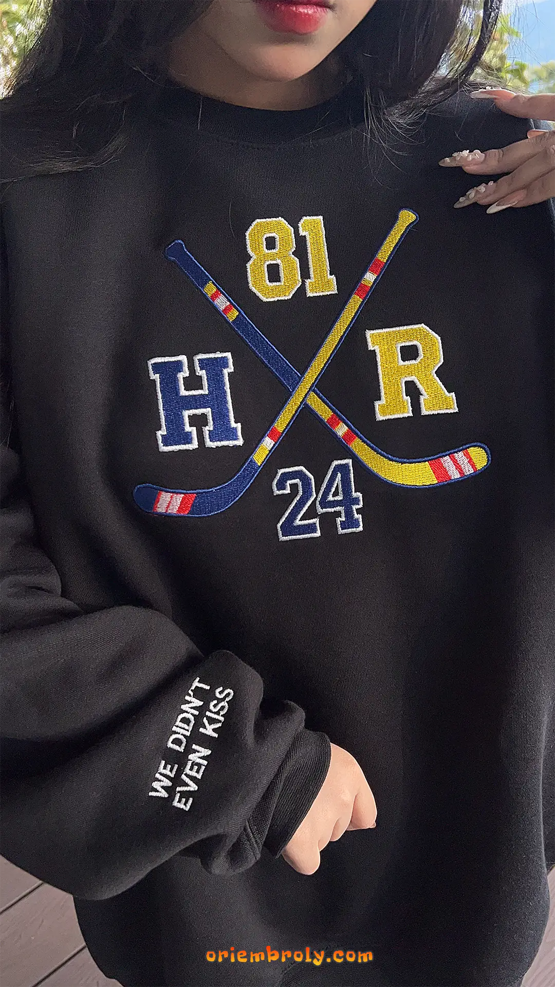 Sleeve embroidery reading We Didn’t Even Kiss quote