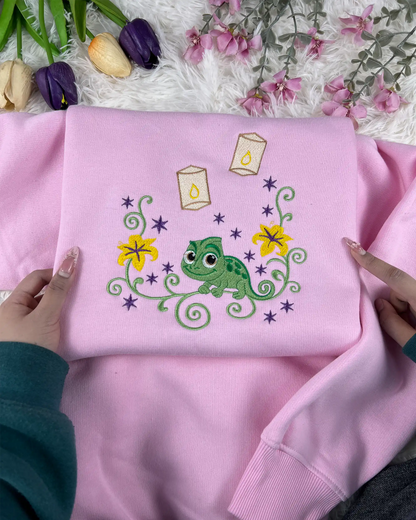whimsical chameleon embroidered sweatshirt flat lay