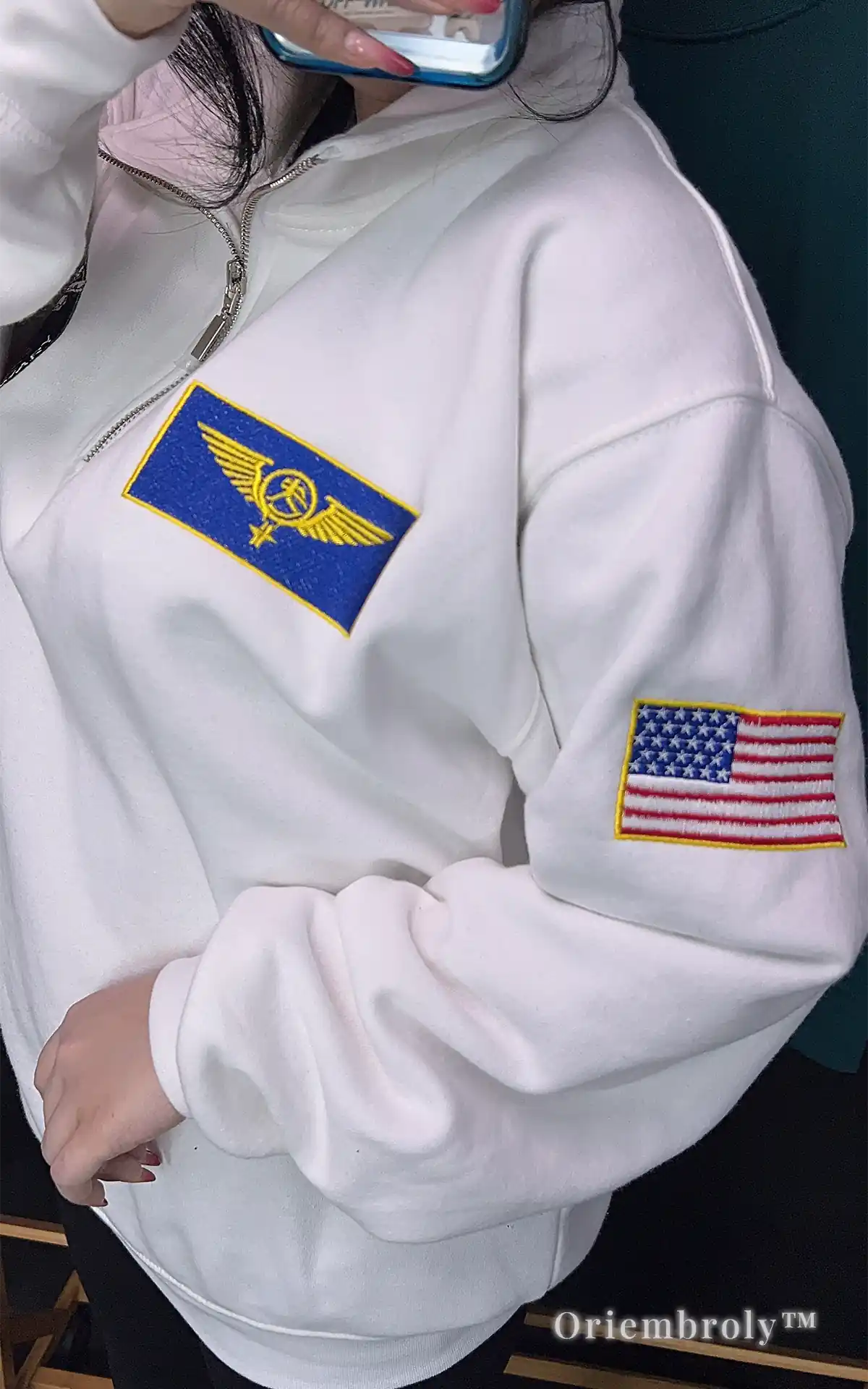 Versatile white half-zip sweatshirt with space exploration and flight wing embroidery. Ideal for layering in fall or spring for a smart, scientific-inspired casual look.
