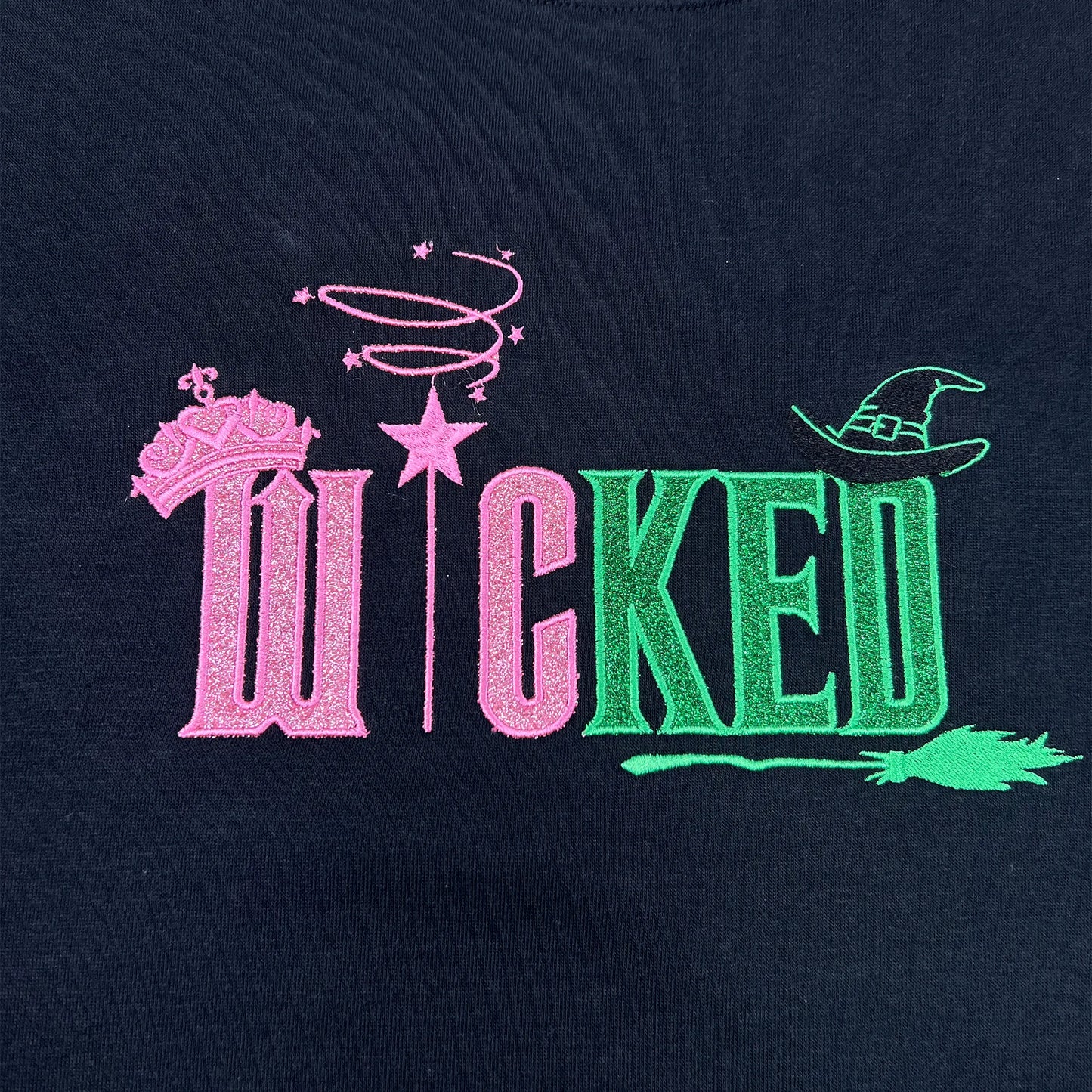 Wicked Defy Gravity embroidered sweatshirt with side bow embroidery, inspired by Glinda and Elphaba from the musical Wicked. Soft cotton hoodie with high-quality stitching