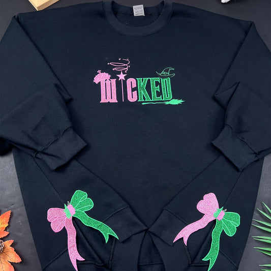 Wicked Defy Gravity embroidered sweatshirt with side bow embroidery, inspired by Glinda and Elphaba from the musical Wicked. Soft cotton hoodie with high-quality stitching