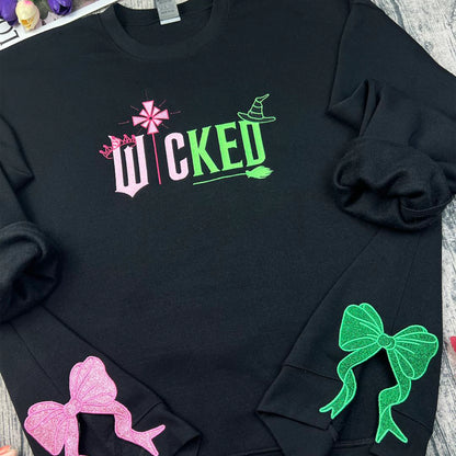 Wicked Glitter Embroidered Sweatshirt inspired by the musical Wicked, featuring appliqué embroidery, perfect for Wizard of Oz and Defying Gravity fans.