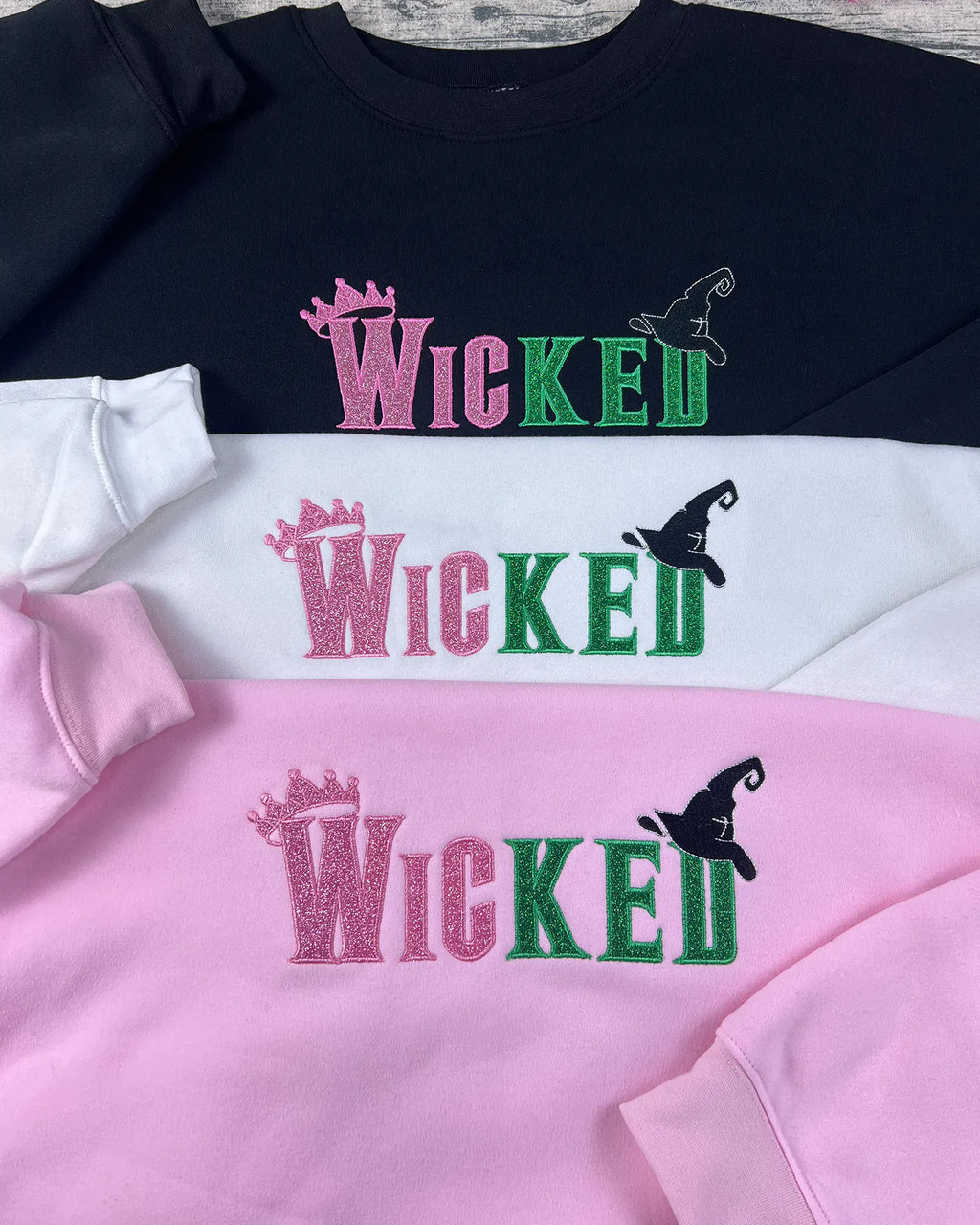 Wicked movie merchandise hoodie with embroidery quote