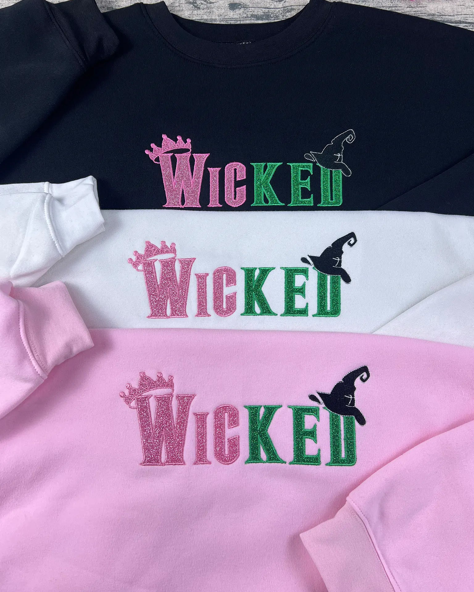 Wicked movie merchandise hoodie with embroidery quote