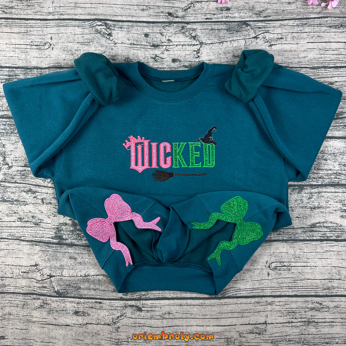 Wicked Glitter Side Bow embroidered sweatshirt with Defy Gravity design
