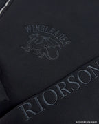 Close-up of Wingleader dragon embroidery on left chest