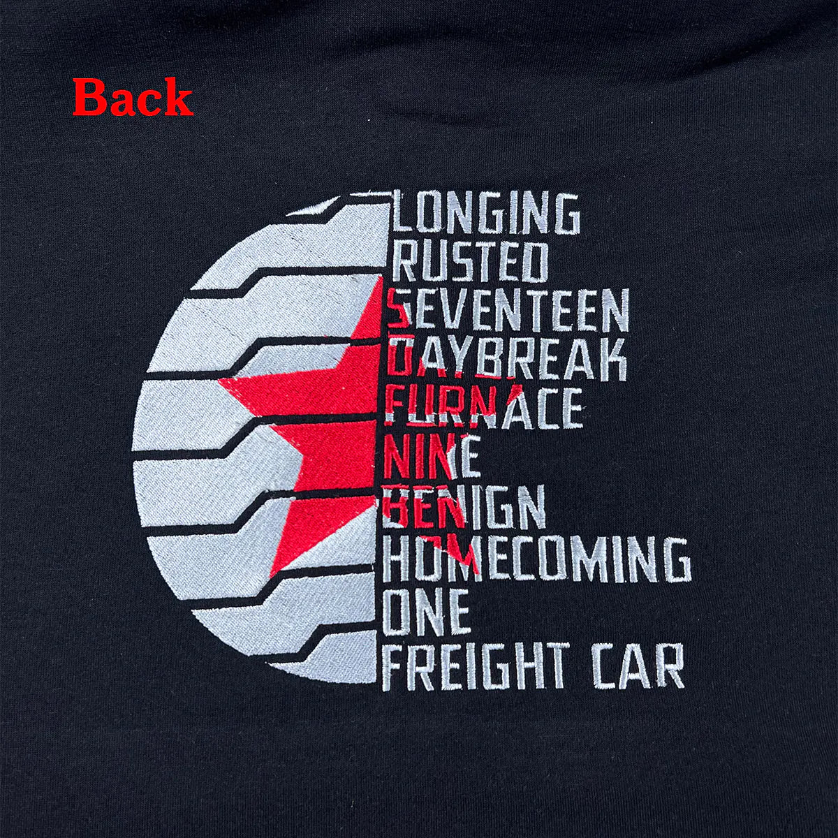 Black sweatshirt with text and red star design on the back