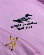 Black and white loon bird embroidery detail on crewneck