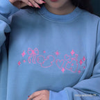 Y2K aesthetic embroidered crewneck sweatshirt flat lay